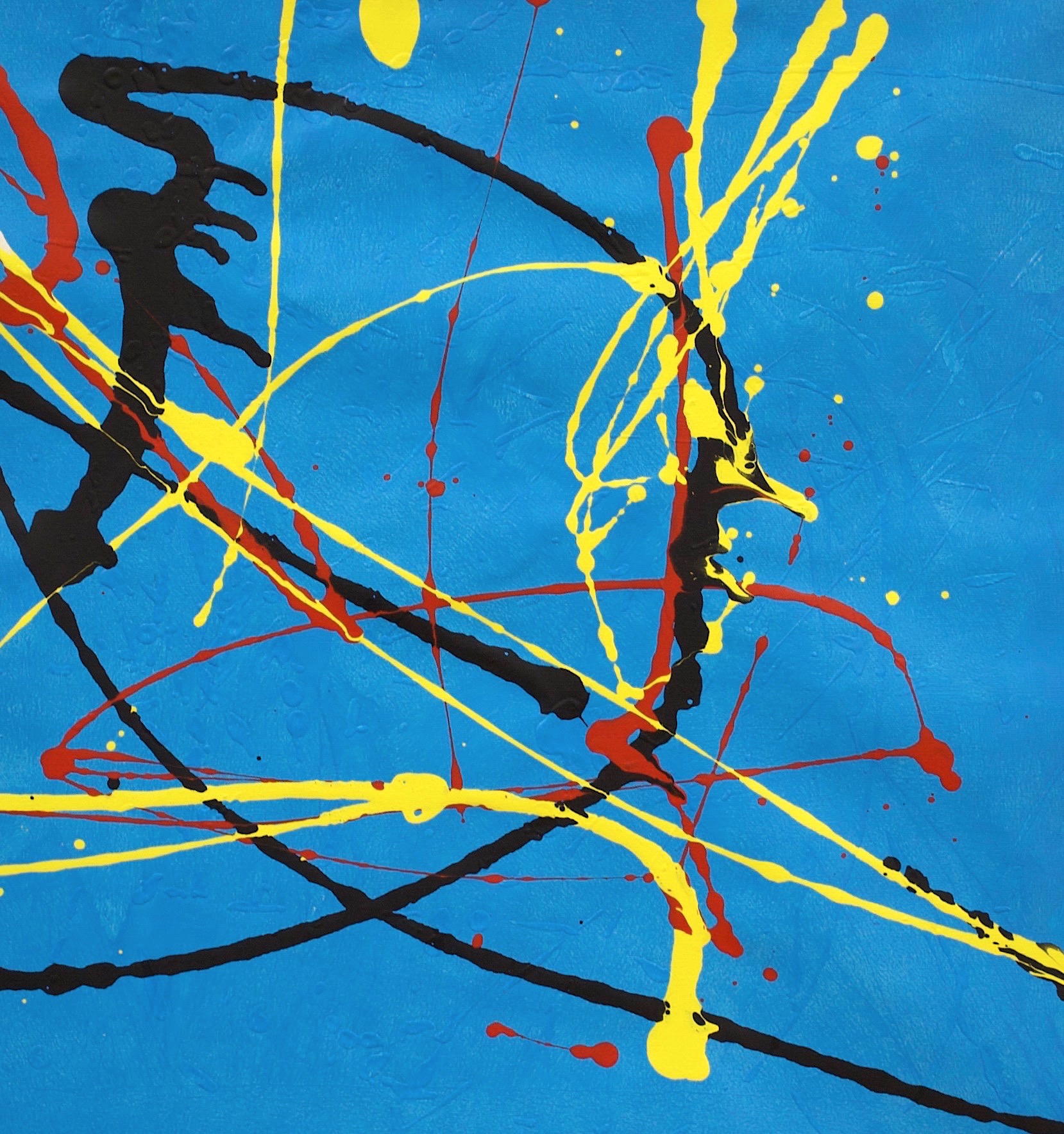 Red, black and yellow splatter on a blue background.