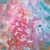 An abstract acrylic painting depicting swirls of magenta, light pink, turquoise, and flecks of blue.