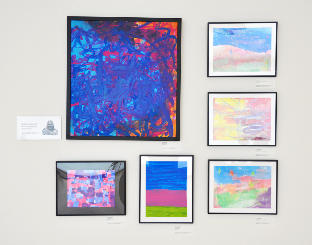 Six paintings on a wall