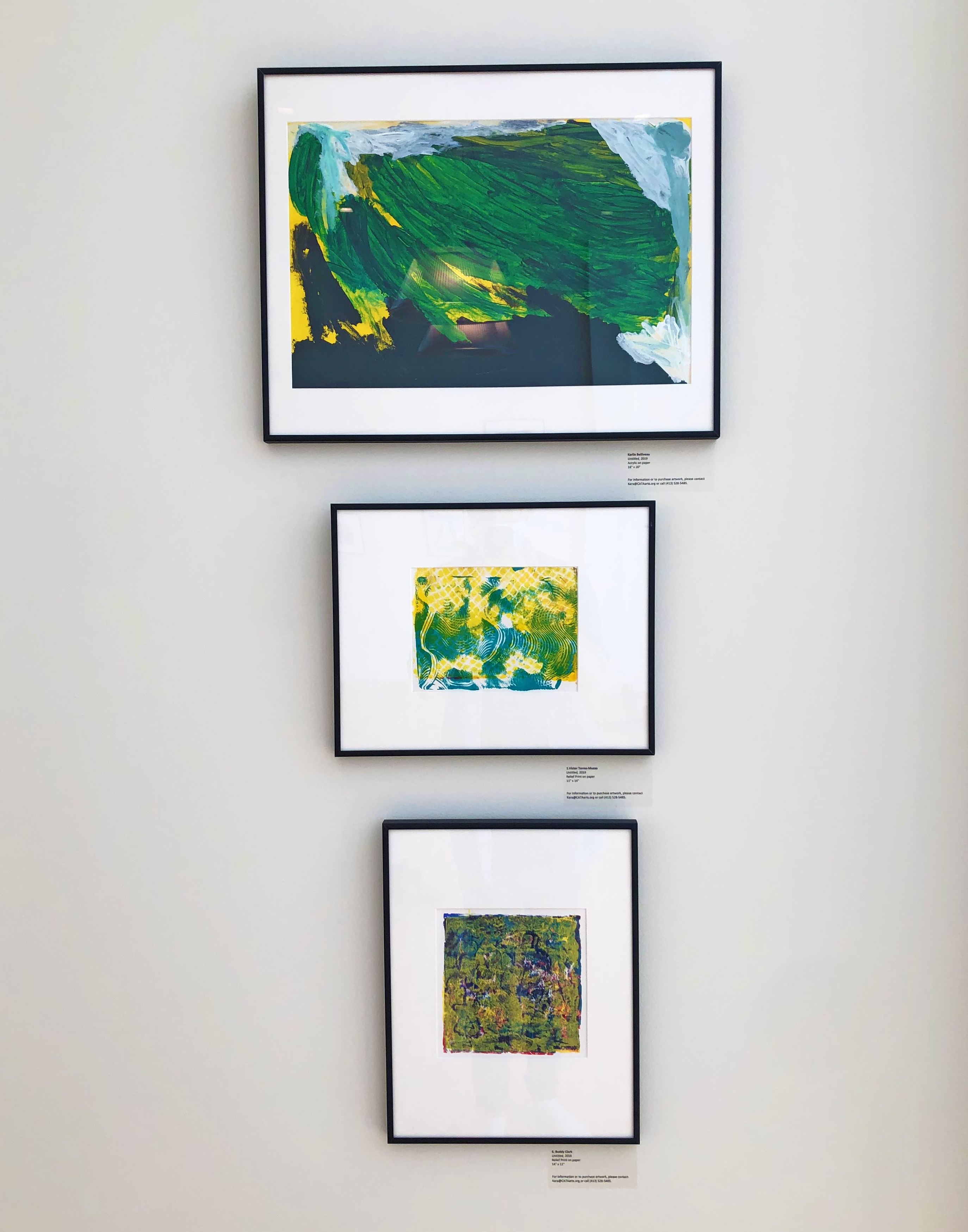Three paintings on a wall
