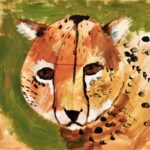 Round cheetah head in center of the page with top of shoulders entering from the right side of the paper. Cheetah fur is painted with dark orange, light orange, brown, beige and white. Black spots painted on the cheetah. Brown eyes and black nose. Background above and to the left of cheetah is olive-green and beige.