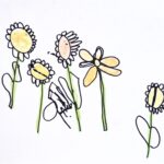 Five flowers drawn onto white paper using black sharpie. Flowers are each painted a light-orange/yellow color with a light-green stem. Center flower is a light-pink. First flower on viewer's left has a green smiley face in the center.