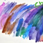 Abstract, multicolor watercolor painting on white paper. Brush strokes of different shades of purple, pink, blue, green and brown.