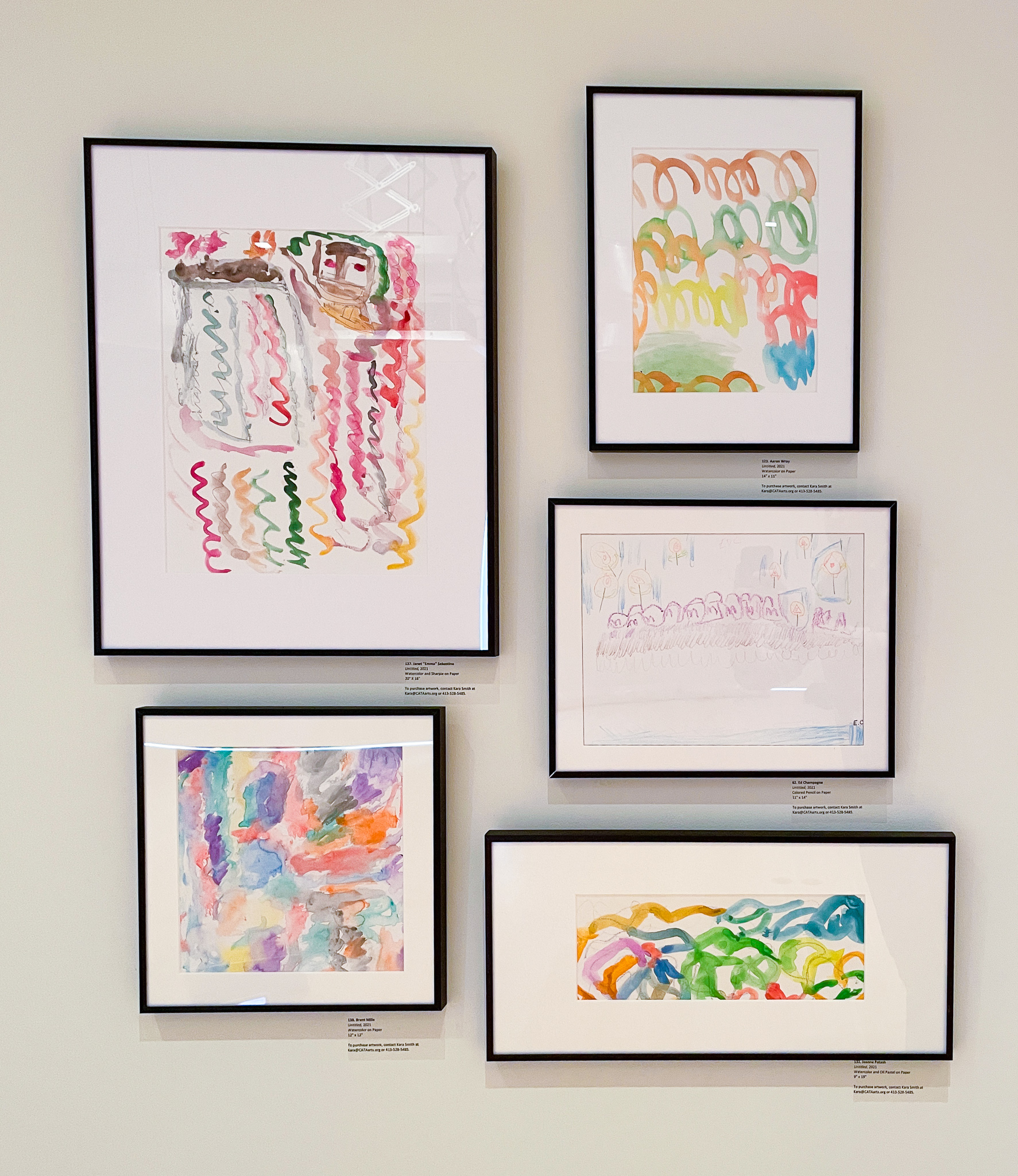 Gallery wall with five abstract paintings