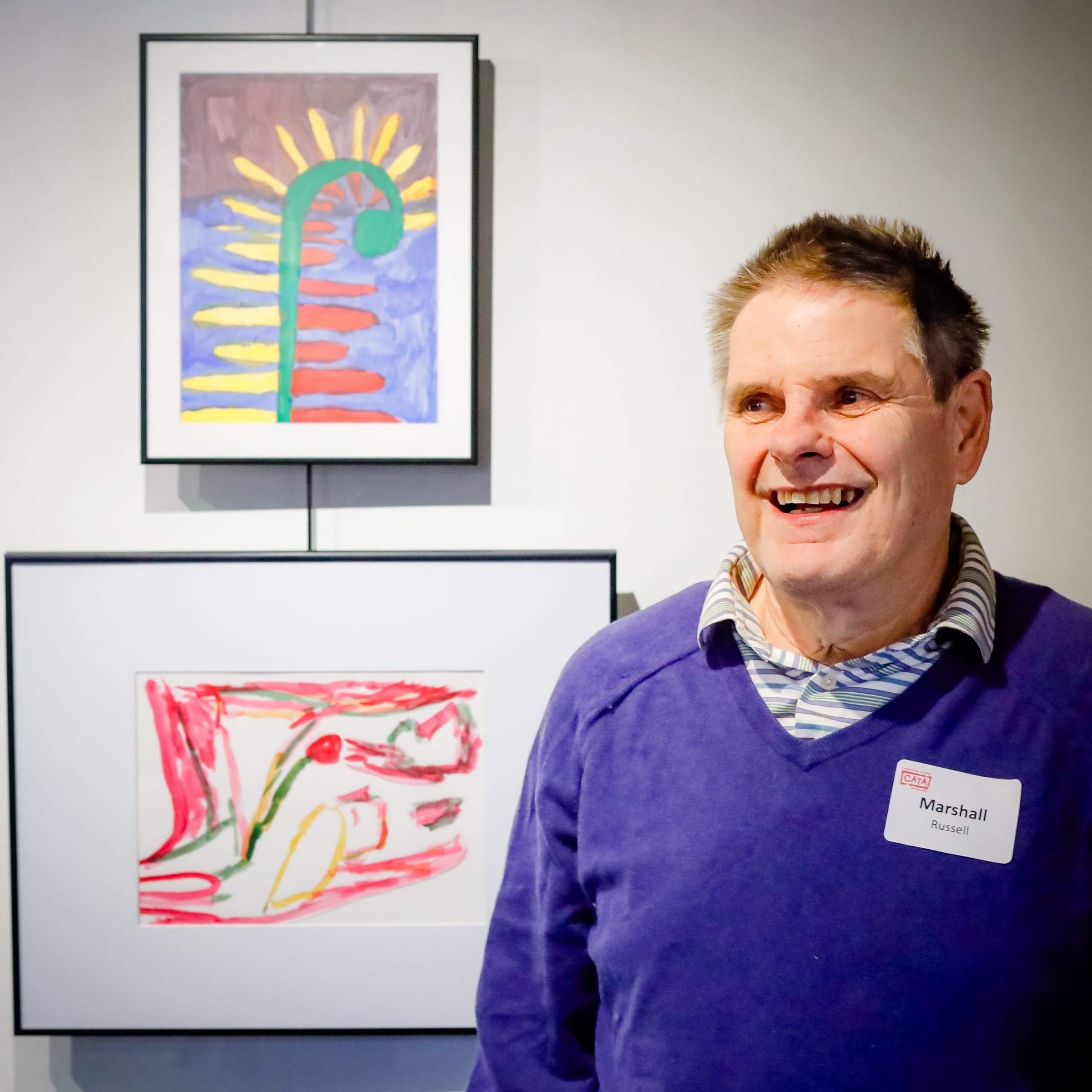 CATA artist Marshall stands near his art at Berkshire Botanical Garden.