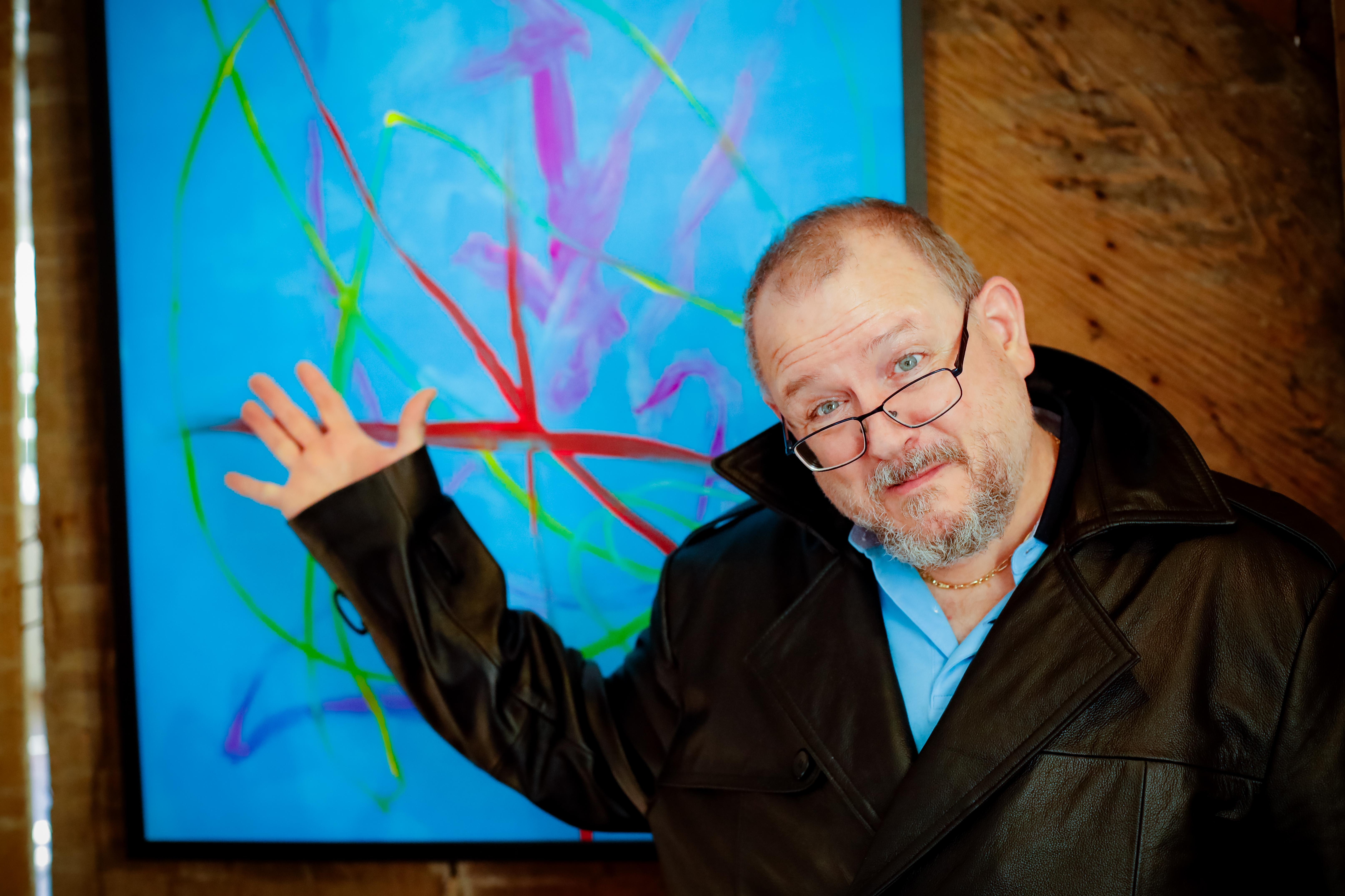 Photo: John Chapdelaine (BCArc Nu-Opps Brain Injury Program) with his painting “Jellyfish”