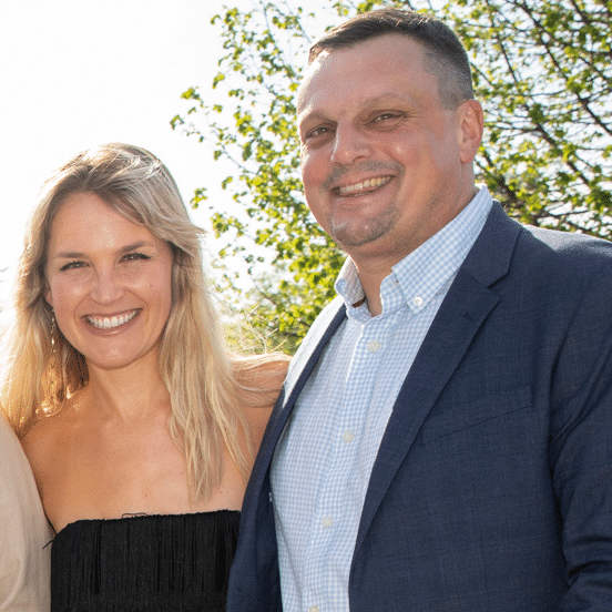 Mary and Benjamin Daire pose outside.
