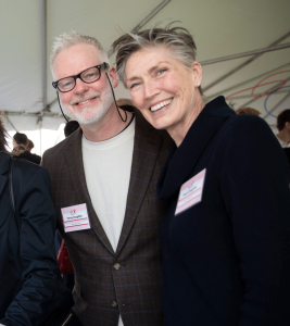 Two people smiling for a photo.