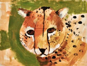 Image: Portrait of a cheetah on green background