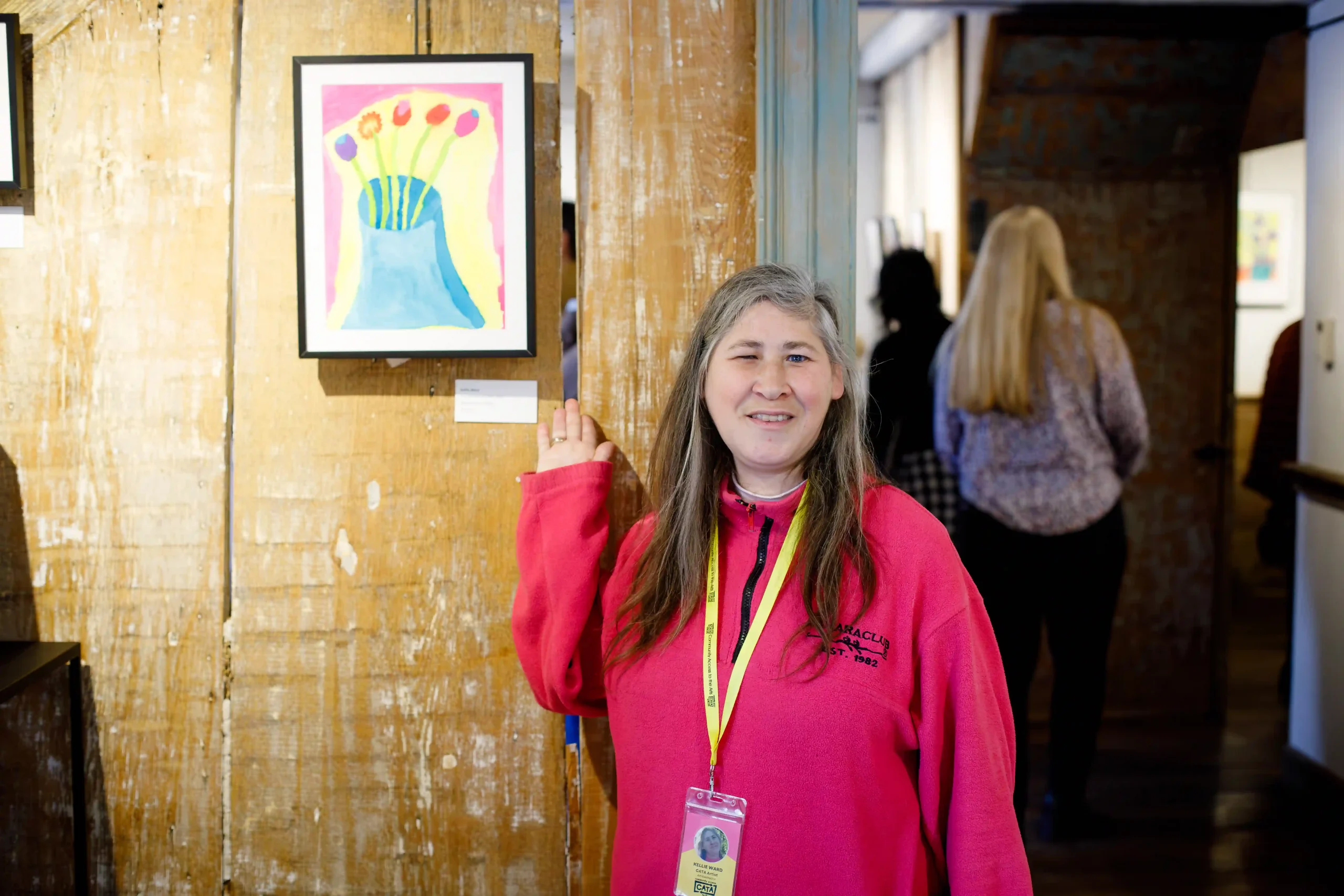 CATA artist Kellie (Oakdale) with her painting, "The Five Flowers of CATA."