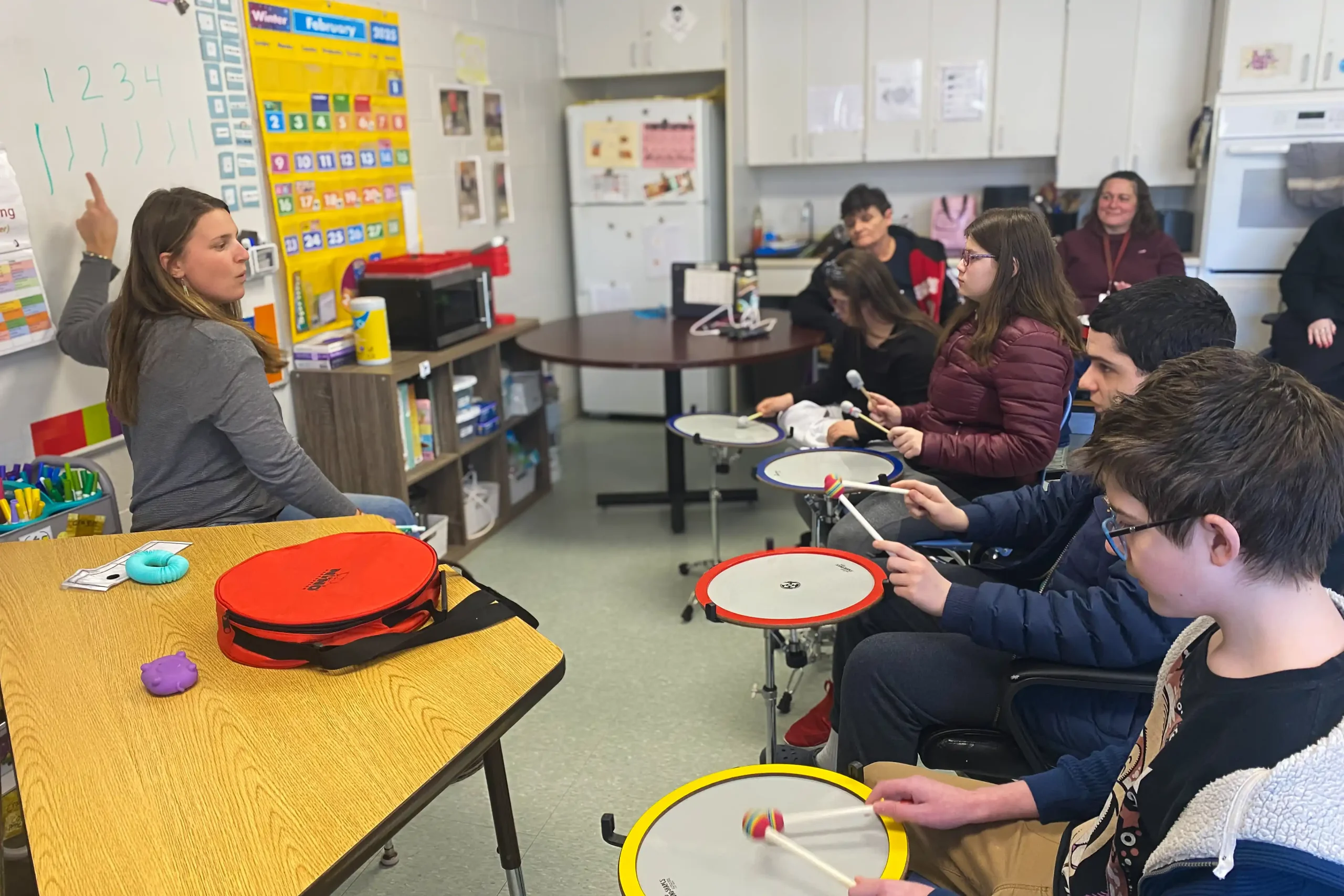 Local students learn new drumming techniques in a CATA workshop.