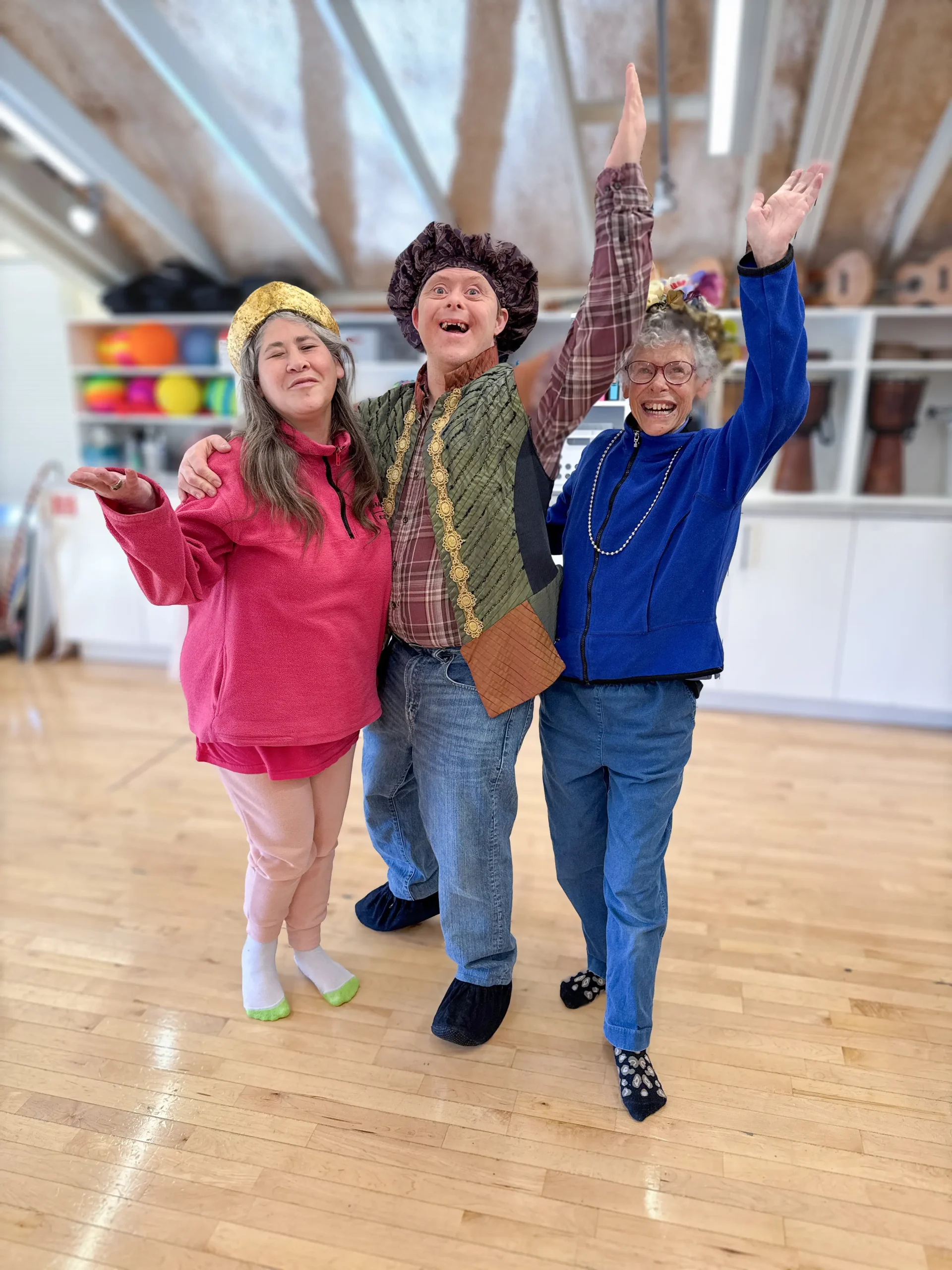 Three people in costume posing in a studio
